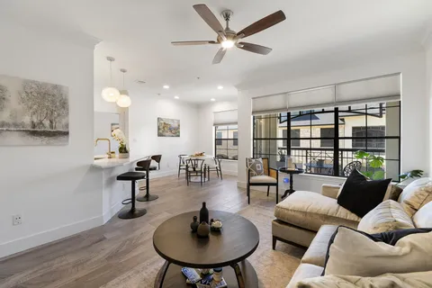 a living room with furniture and a table
