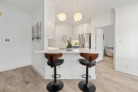 a view of living room with furniture and window