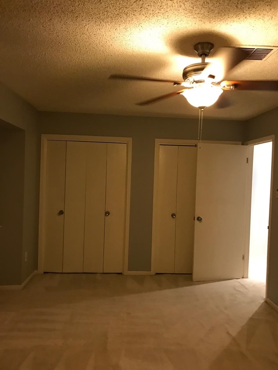 5588 Clarke Address, Unit 51 Memphis, TN 38115 - Photo 7 of 13 a view of a chandelier fan and closet in a room