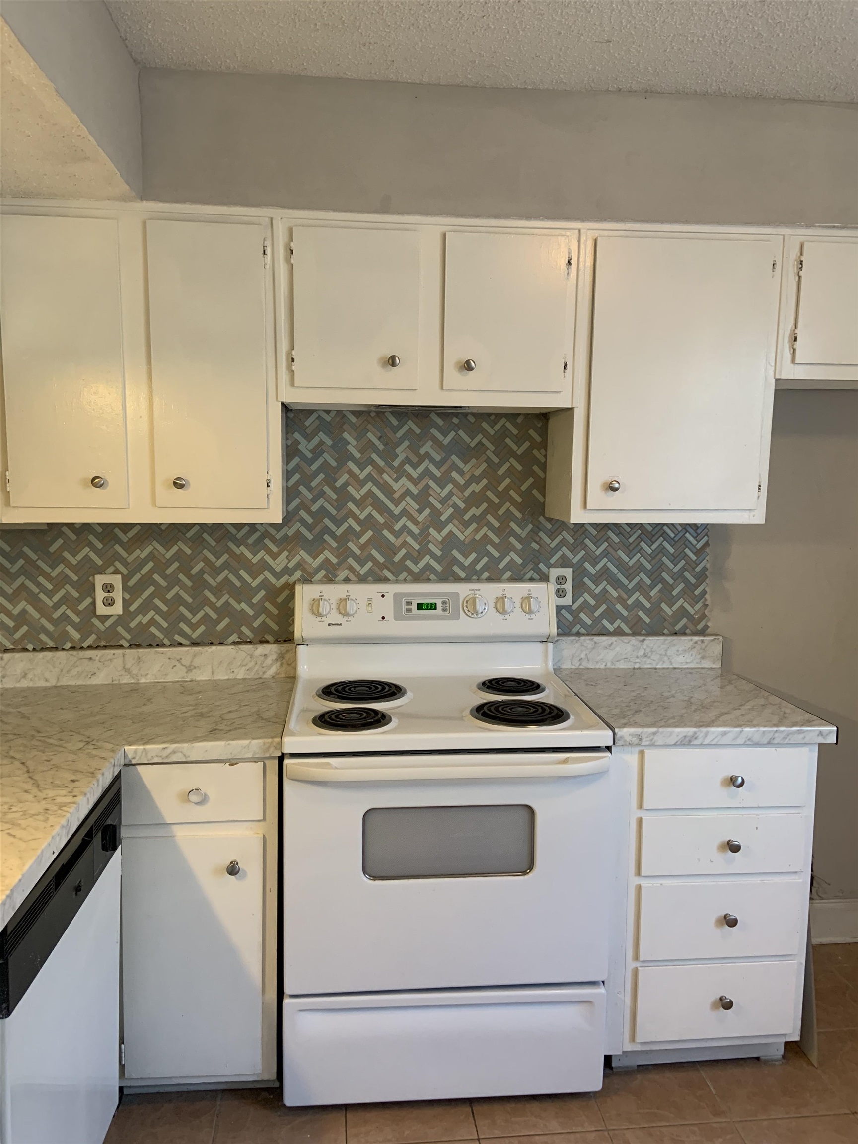 5588 Clarke Address, Unit 51 Memphis, TN 38115 - Photo 10 of 13 a white stove top oven sitting inside of a kitchen