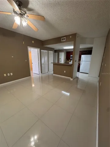 a view of empty room with window and fireplace