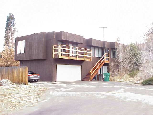 a view of a house next to a road