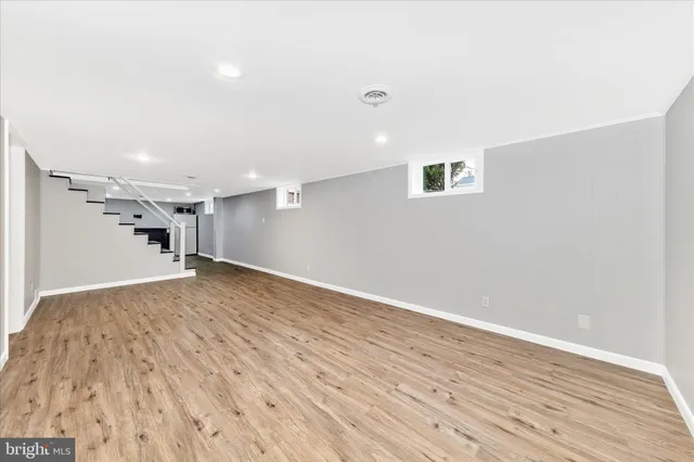 a view of a porch with wooden floor and fence