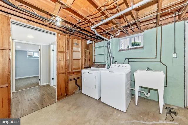 a view of a large house with a yard and lake view