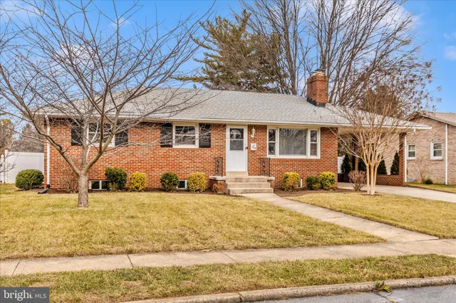 a view of yard with swimming pool and seating