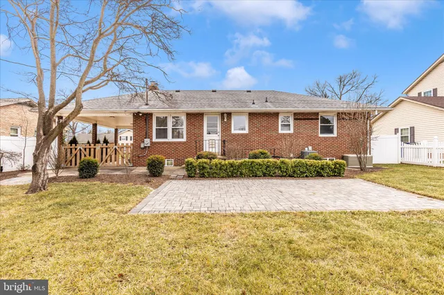 a view of a fountain in front of house with a swimming pool