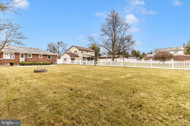 a view of a lake with a yard and a fountain