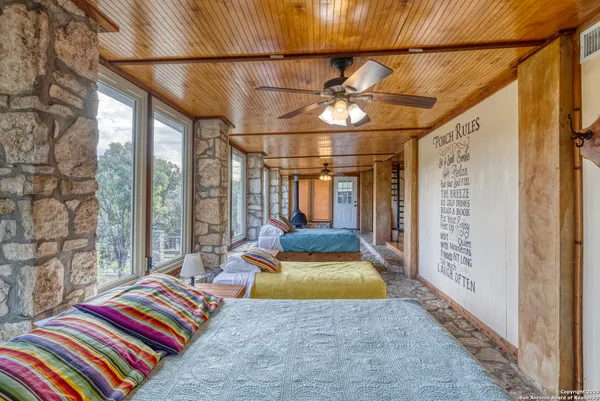 a bedroom with furniture and a window