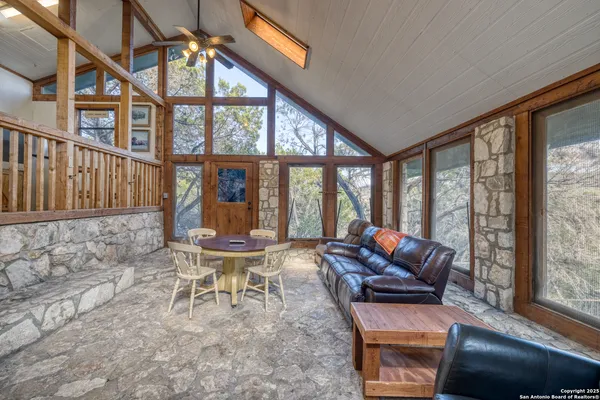 a view of a kitchen with furniture and windows
