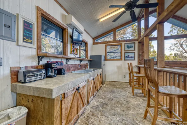 a balcony with furniture and wooden floor