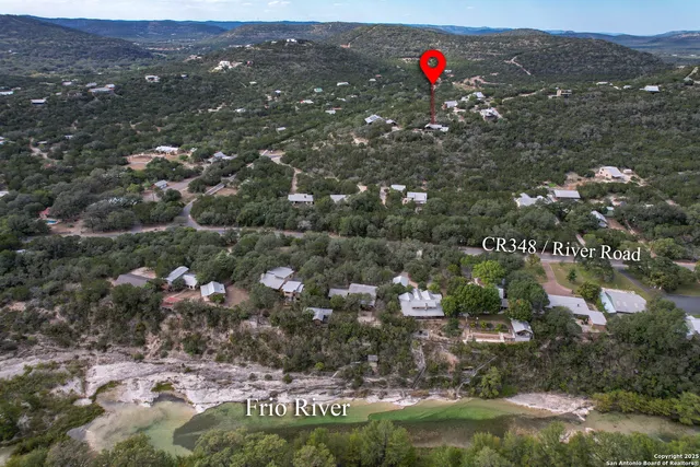 an aerial view of a house with a garden