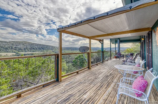 a view of a patio with a table chairs and a table