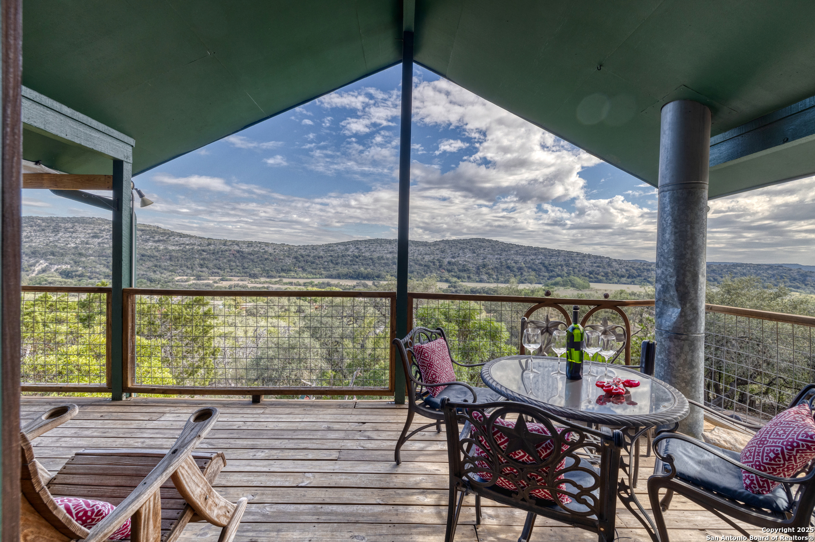 186 Cat Claw Mountain Road Concan, TX 78838 - Photo 23 of 31 a view of a patio with a table chairs and a table