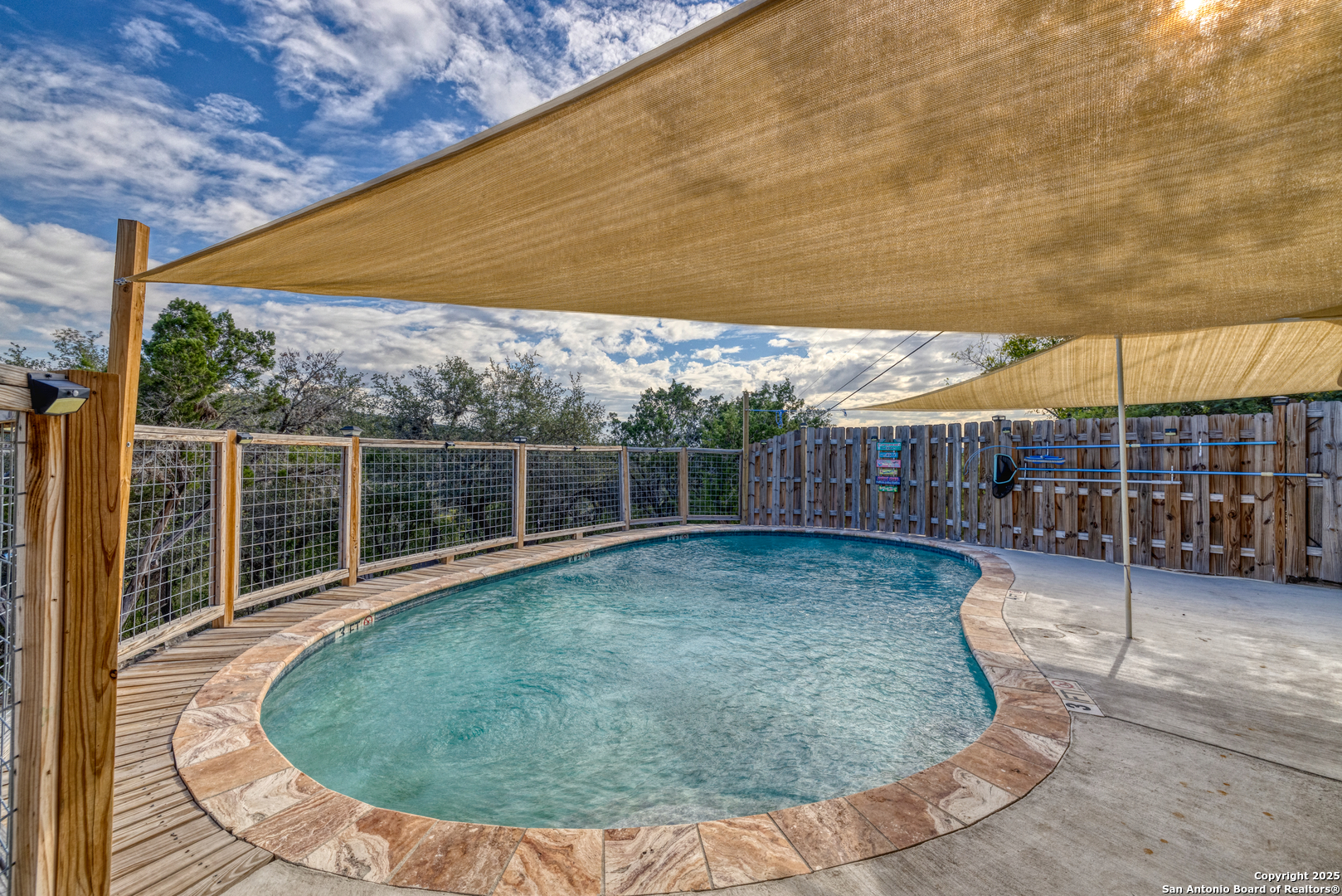 186 Cat Claw Mountain Road Concan, TX 78838 - Photo 24 of 31 a view of a backyard with wooden fence