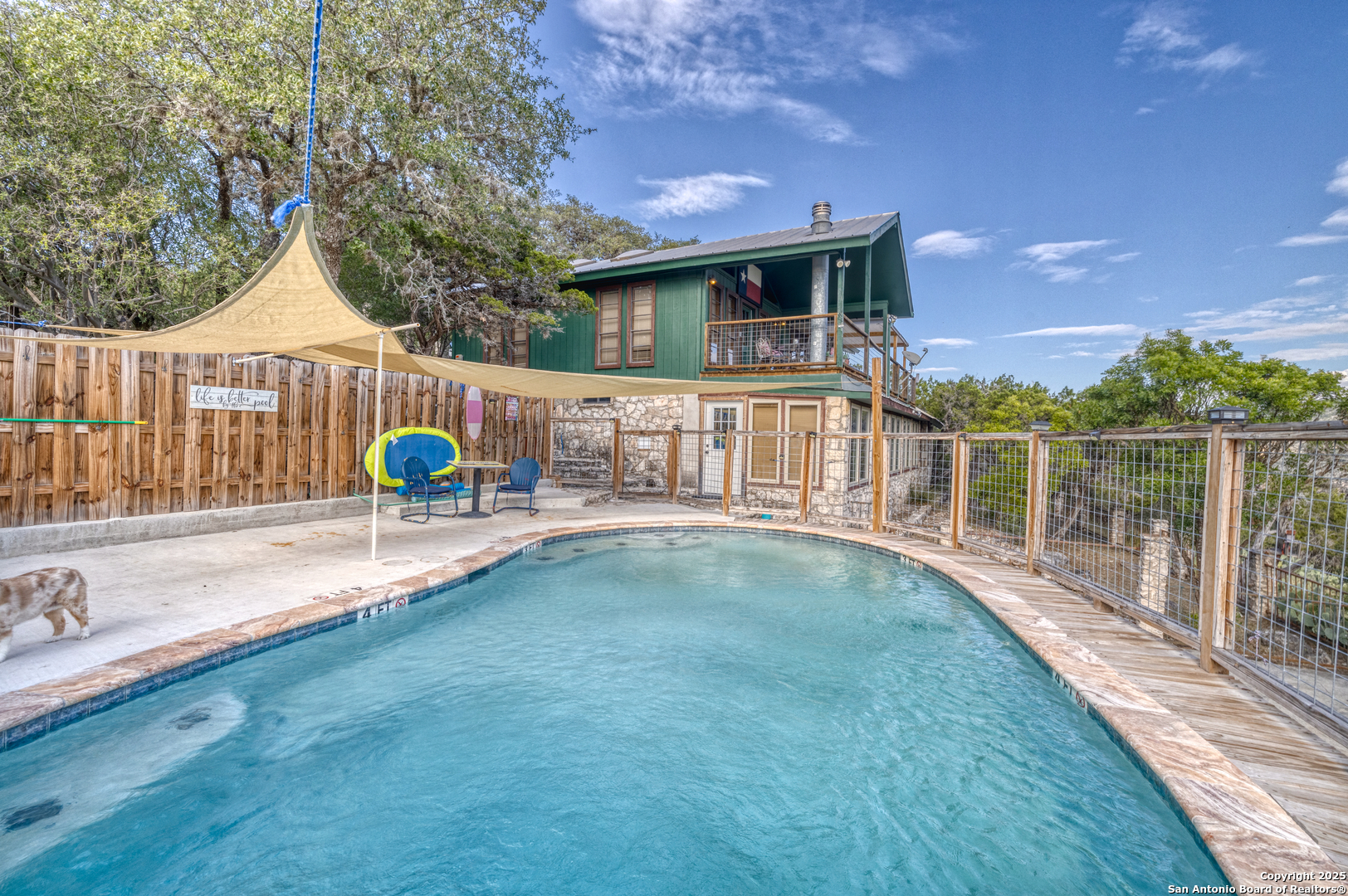 186 Cat Claw Mountain Road Concan, TX 78838 - Photo 25 of 31 a view of a house with a swimming pool