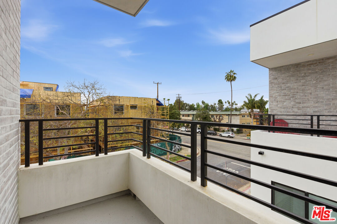 13822 Oxnard Street Van Nuys, CA 91401 - Photo 15 of 23 a view of a balcony with two chairs