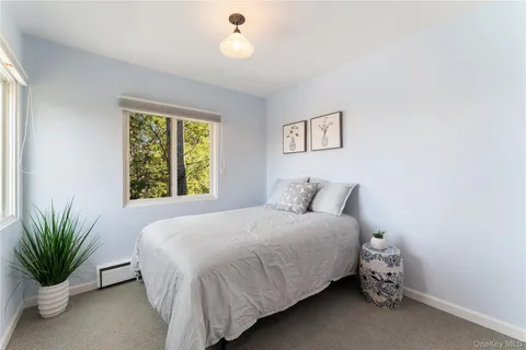a bathroom with a sink mirror and toilet