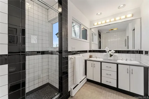 a bedroom with furniture and a chandelier