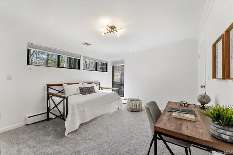 a bedroom with a bed and a cabinets