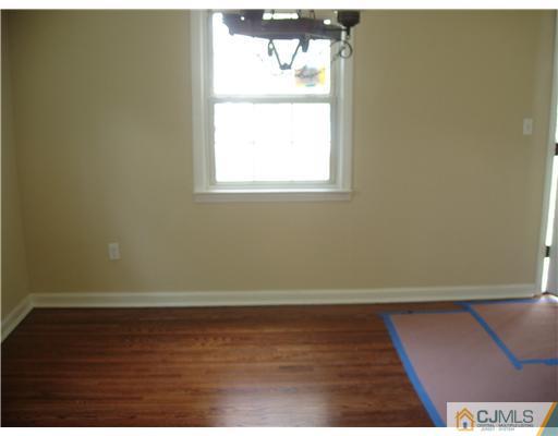 135 Midfield Road Colonia, NJ 07067 - Photo 7 of 18 an empty room with a window