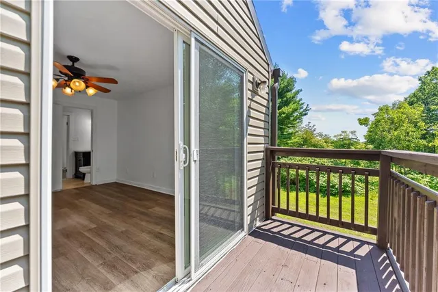 a view of a balcony with wooden floor