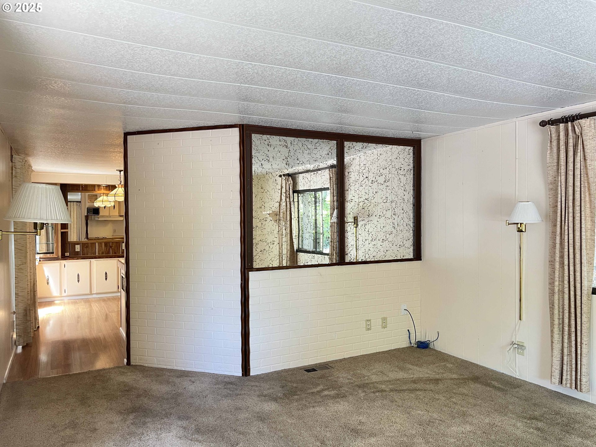 1600 Rhododendron Drive, Unit 261 Florence, OR 97439 - Photo 12 of 42 a view of an empty room with window and cabinet
