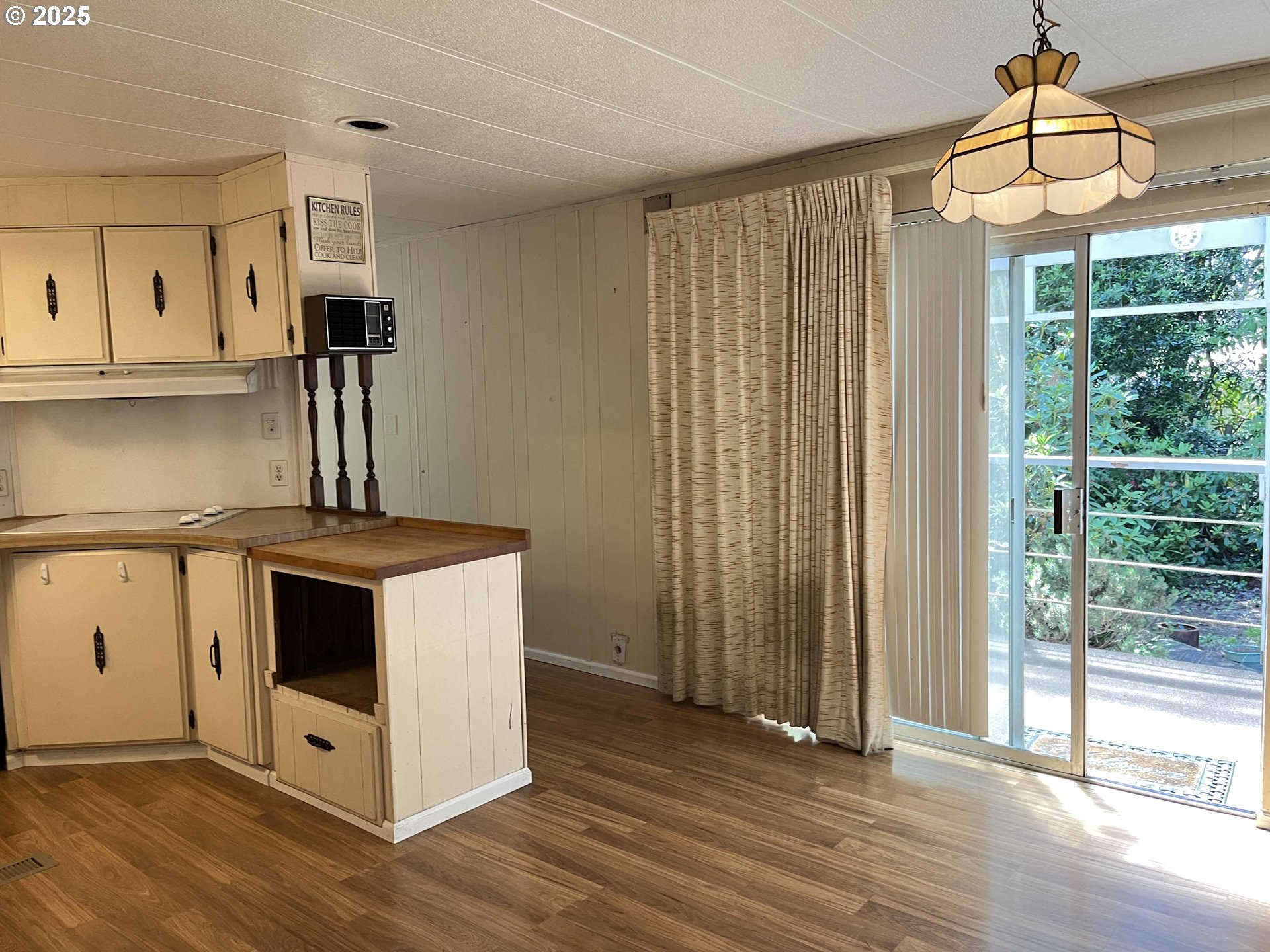 1600 Rhododendron Drive, Unit 261 Florence, OR 97439 - Photo 18 of 42 a kitchen with stainless steel appliances granite countertop a stove a sink and a refrigerator