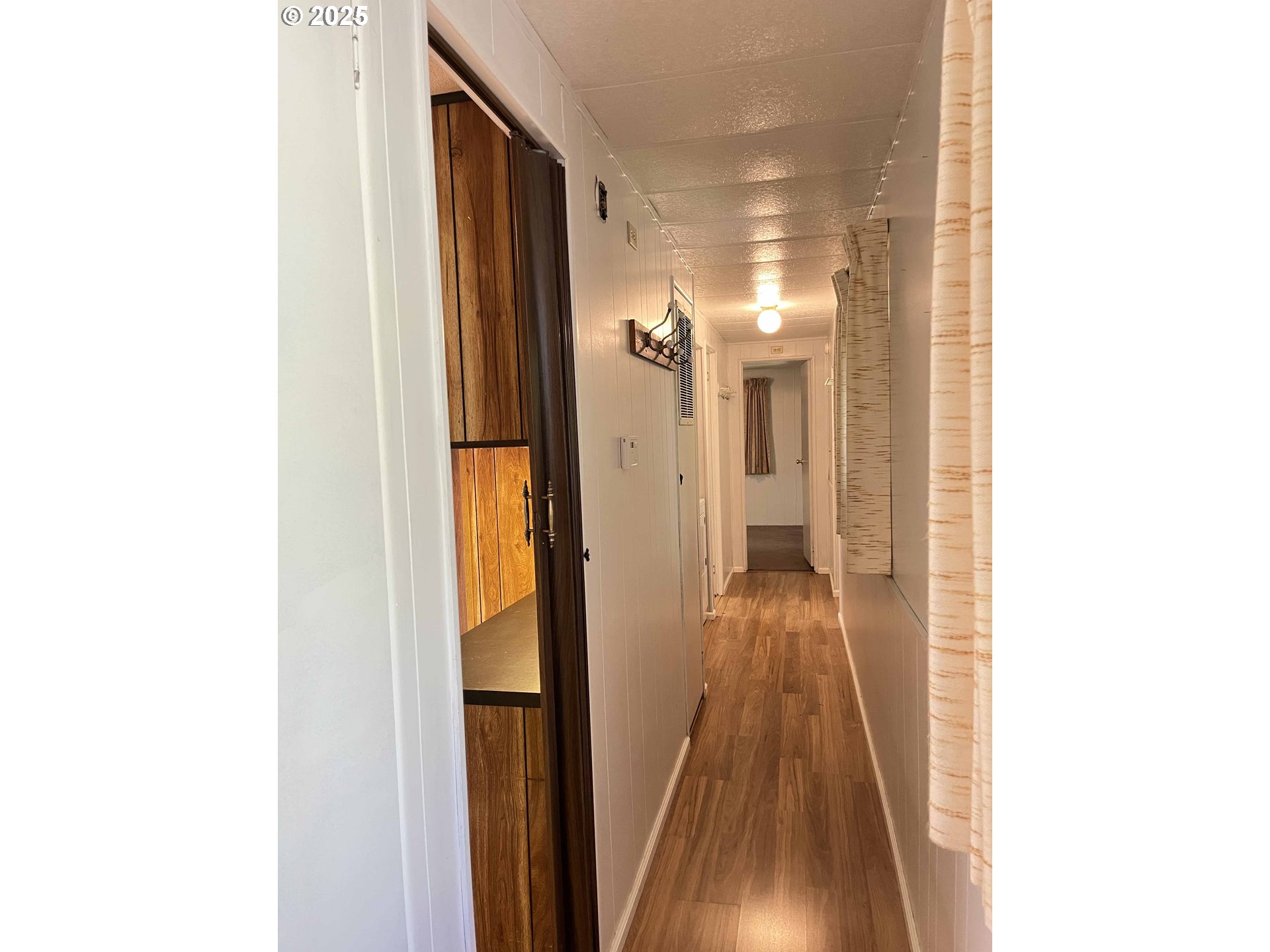 1600 Rhododendron Drive, Unit 261 Florence, OR 97439 - Photo 20 of 42 a view of a hallway with wooden floor
