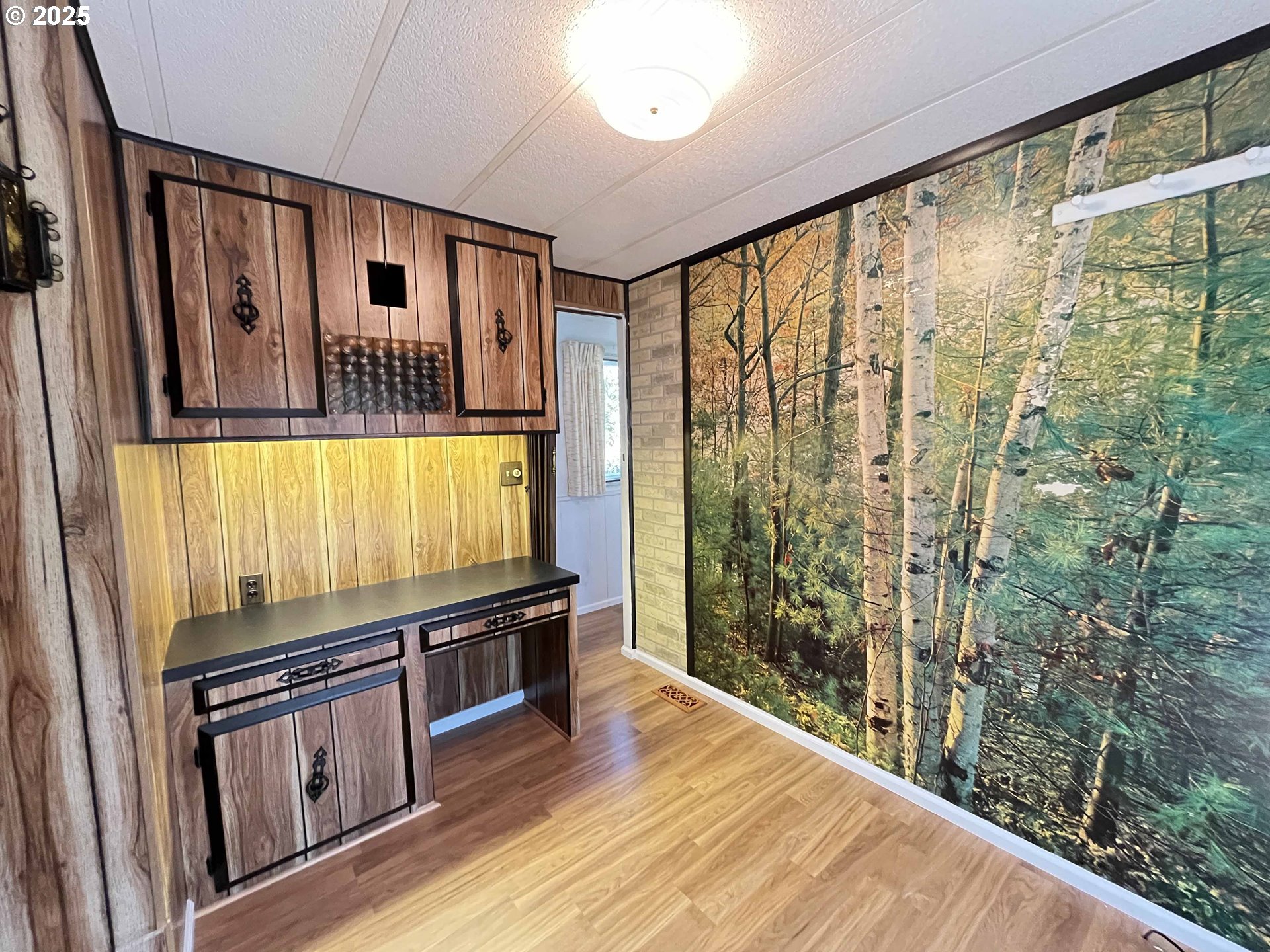 1600 Rhododendron Drive, Unit 261 Florence, OR 97439 - Photo 23 of 42 a kitchen with stainless steel appliances granite countertop a stove and a wooden floors