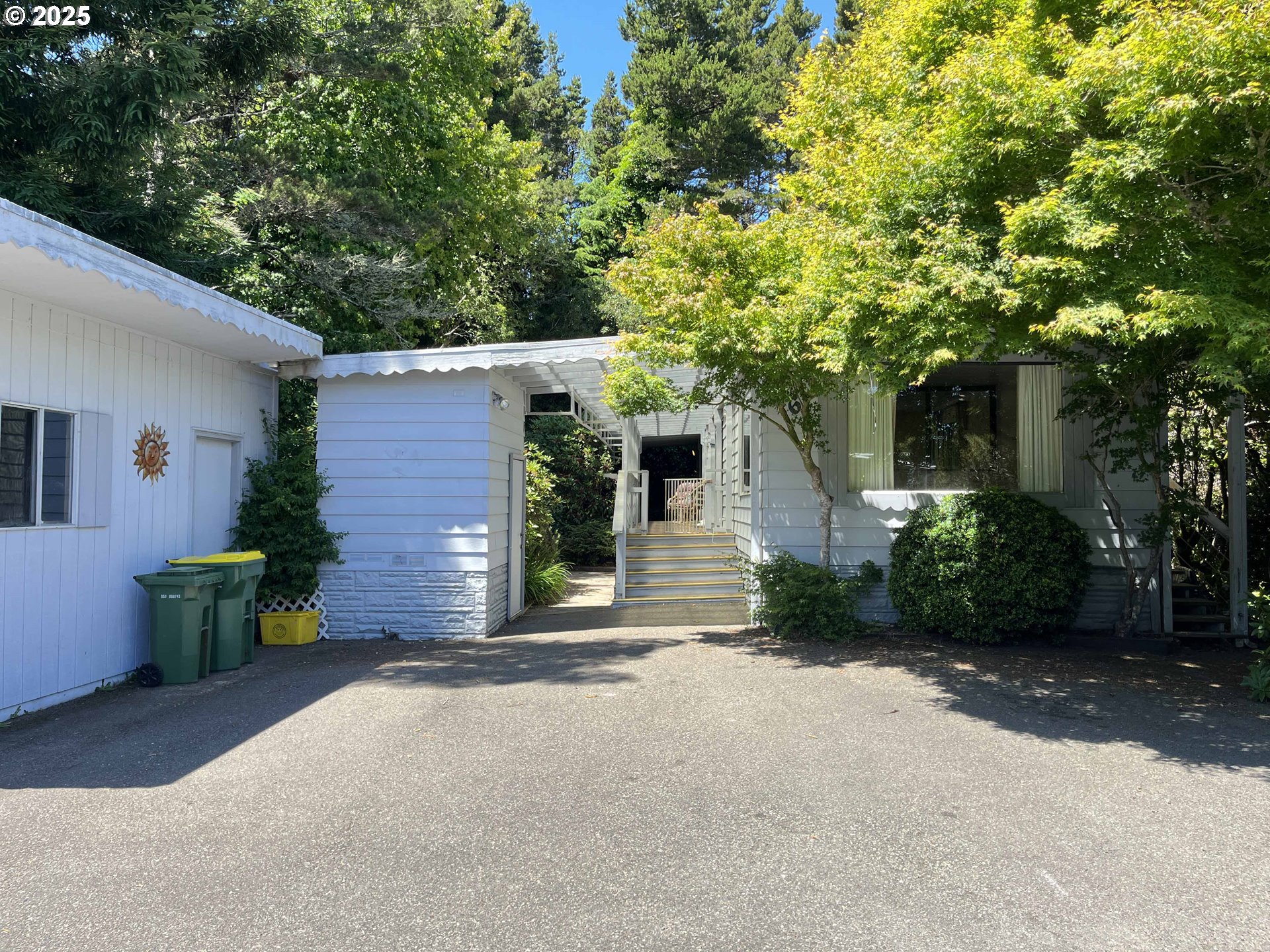 1600 Rhododendron Drive, Unit 261 Florence, OR 97439 - Photo 4 of 42 a view of a house with a yard
