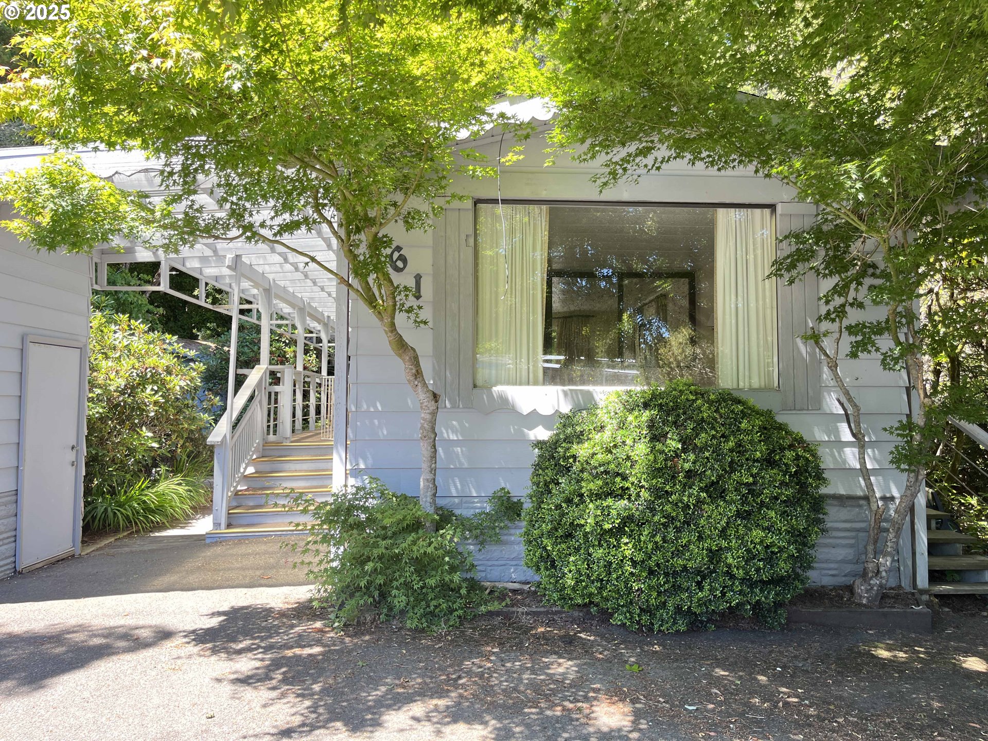 1600 Rhododendron Drive, Unit 261 Florence, OR 97439 - Photo 5 of 42 a front view of a house with garden