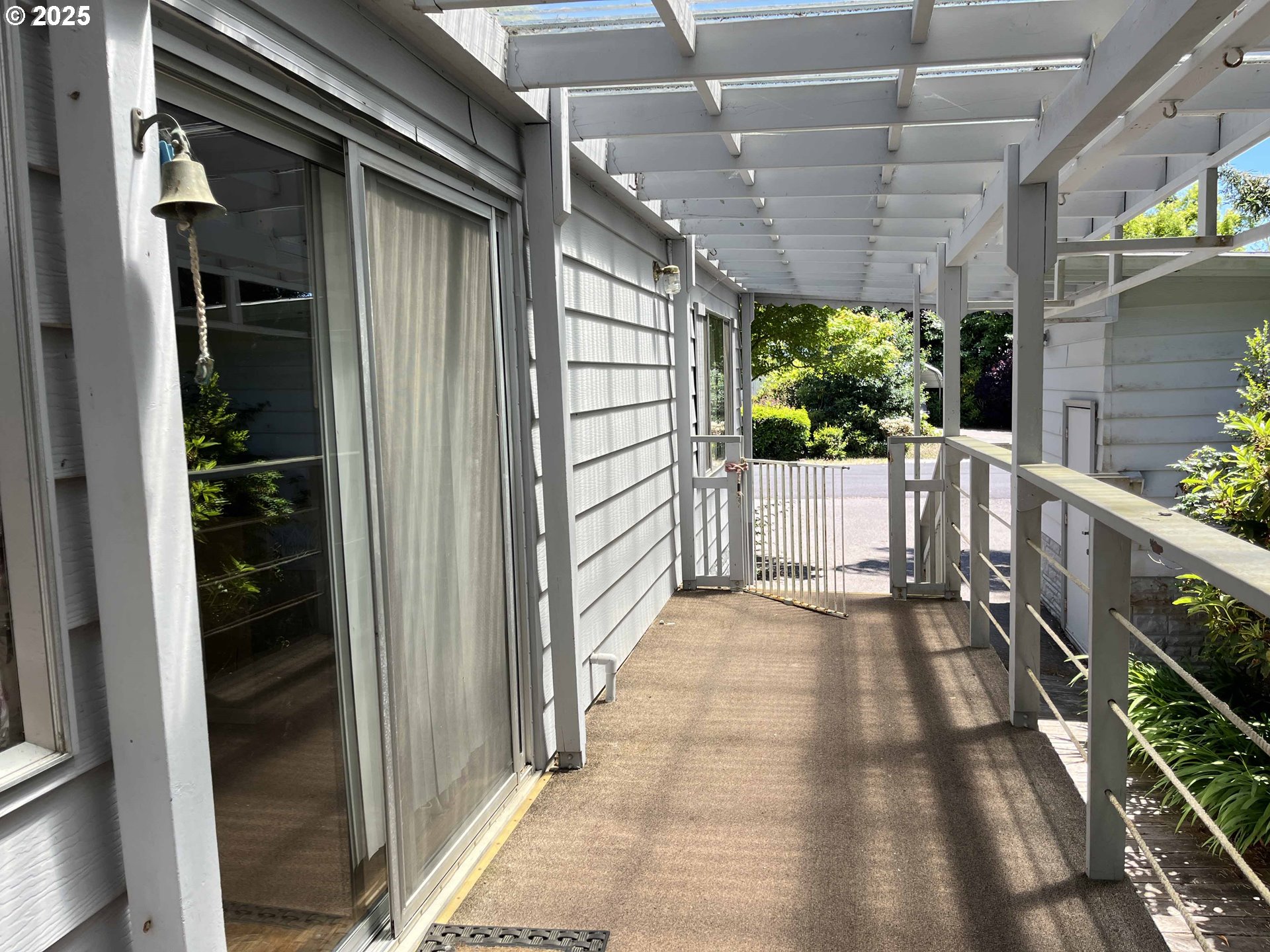 1600 Rhododendron Drive, Unit 261 Florence, OR 97439 - Photo 8 of 42 a view of a porch with wooden floor and stairs