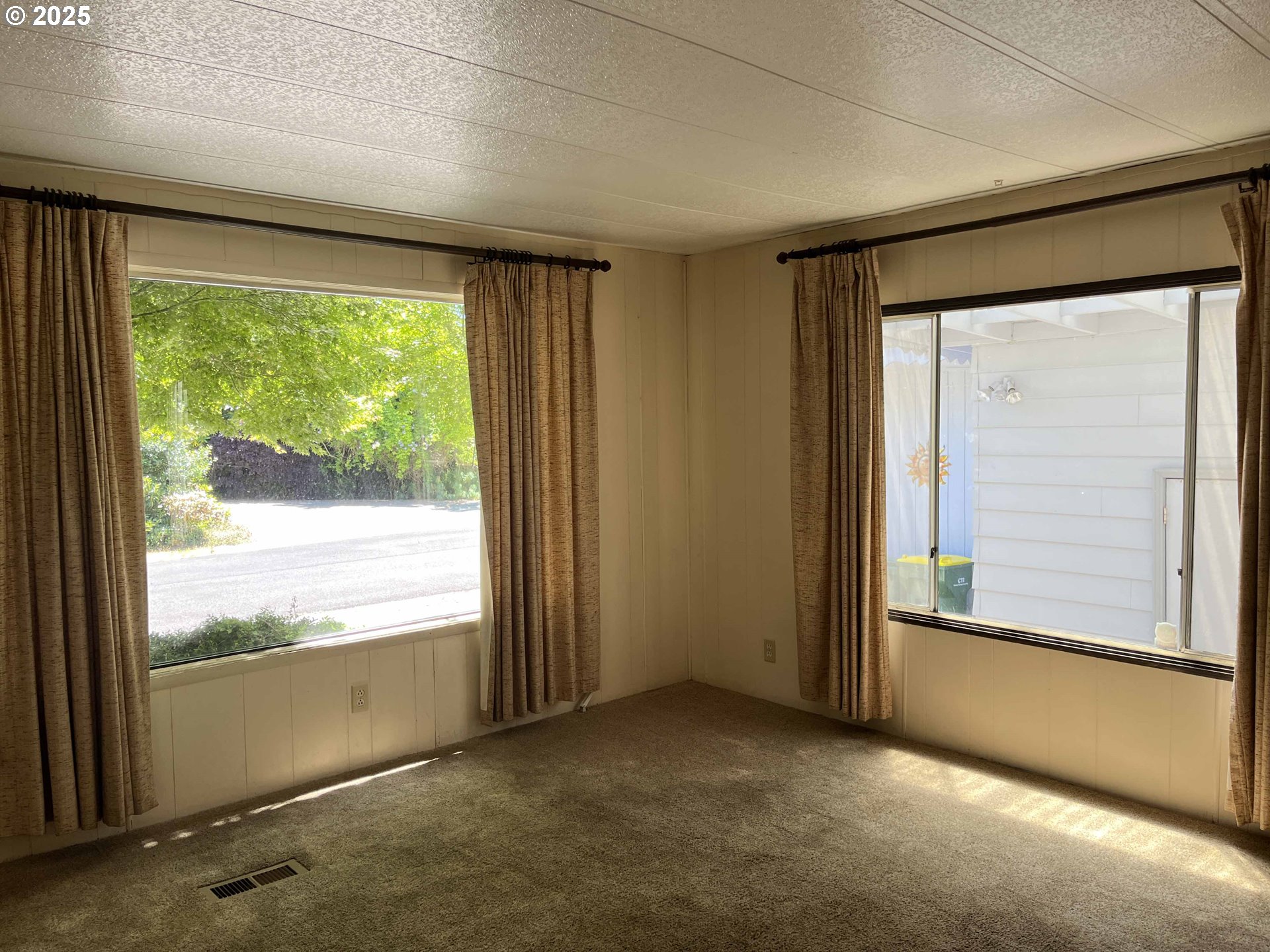 1600 Rhododendron Drive, Unit 261 Florence, OR 97439 - Photo 10 of 42 an empty room with wooden floor and windows