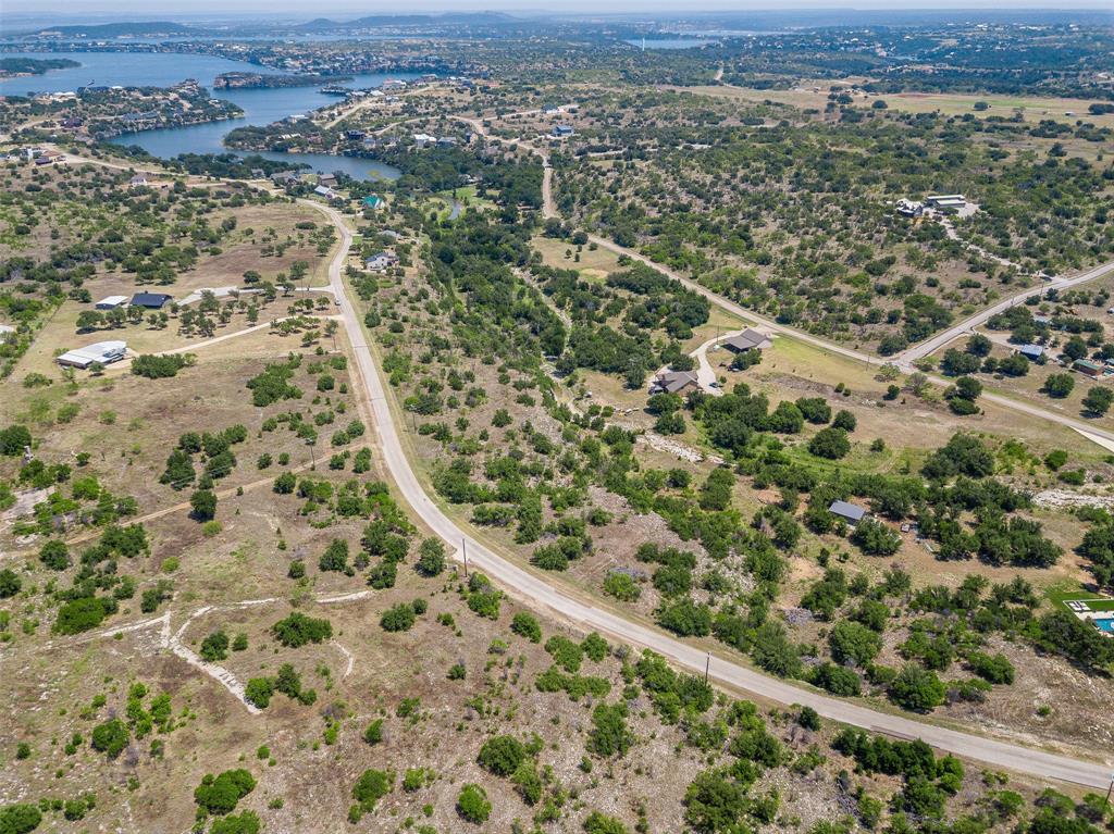 8021 Hells Gate Loop Strawn, TX 76475 - Photo 33 of 39 Aerial view with a water view
