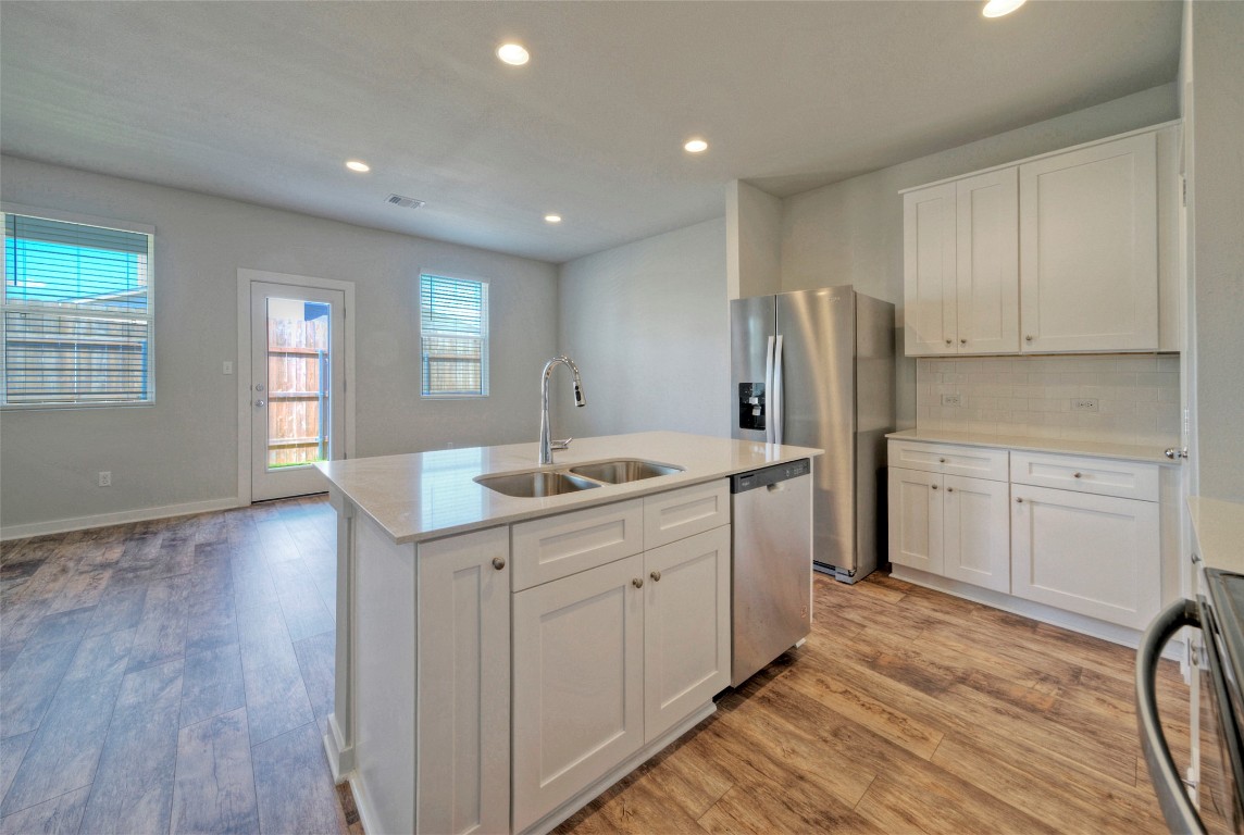 2312 Castillo Drive Round Rock, TX 78664 - Photo 10 of 21 a kitchen with white cabinets and sink