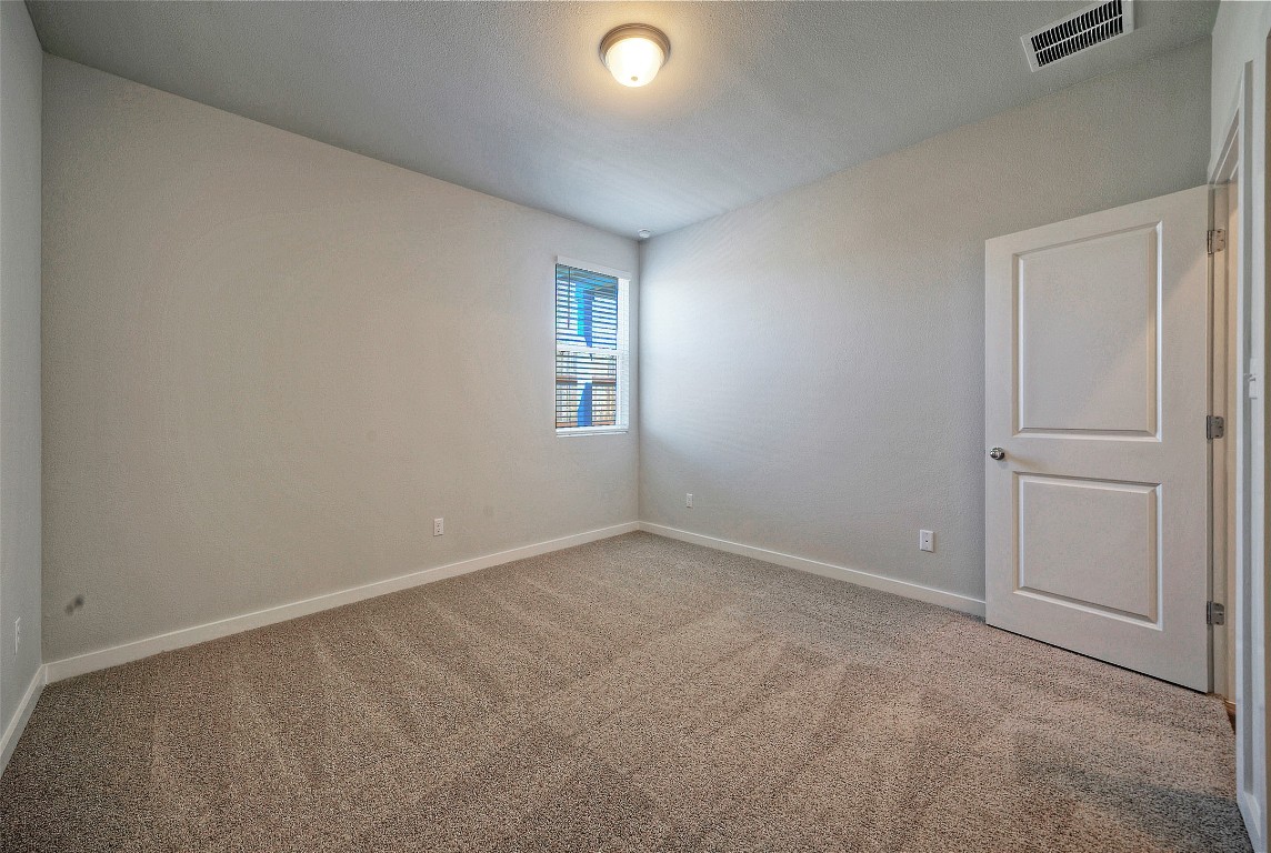 2312 Castillo Drive Round Rock, TX 78664 - Photo 13 of 21 an empty room with windows and closet