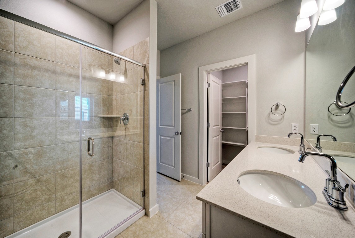 2312 Castillo Drive Round Rock, TX 78664 - Photo 16 of 21 a bathroom with a sink and a mirror