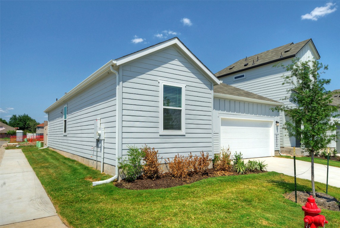 2312 Castillo Drive Round Rock, TX 78664 - Photo 2 of 21 a front view of house with a garden