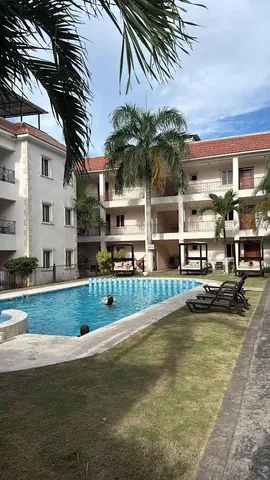 a view of swimming pool with outdoor seating