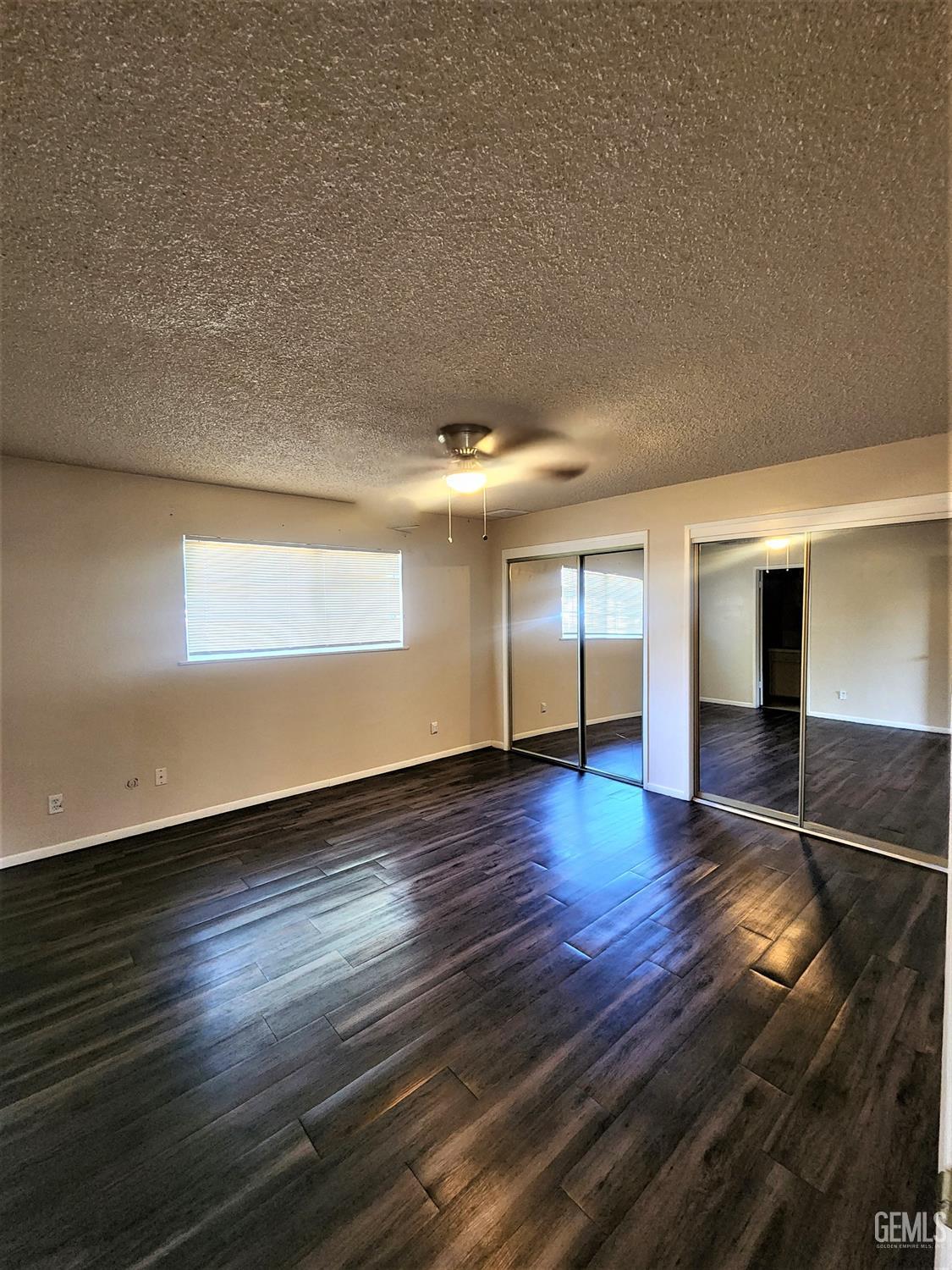 Undisclosed Address Bakersfield, CA 93306 - Photo 11 of 18 a view of empty room with wooden floor