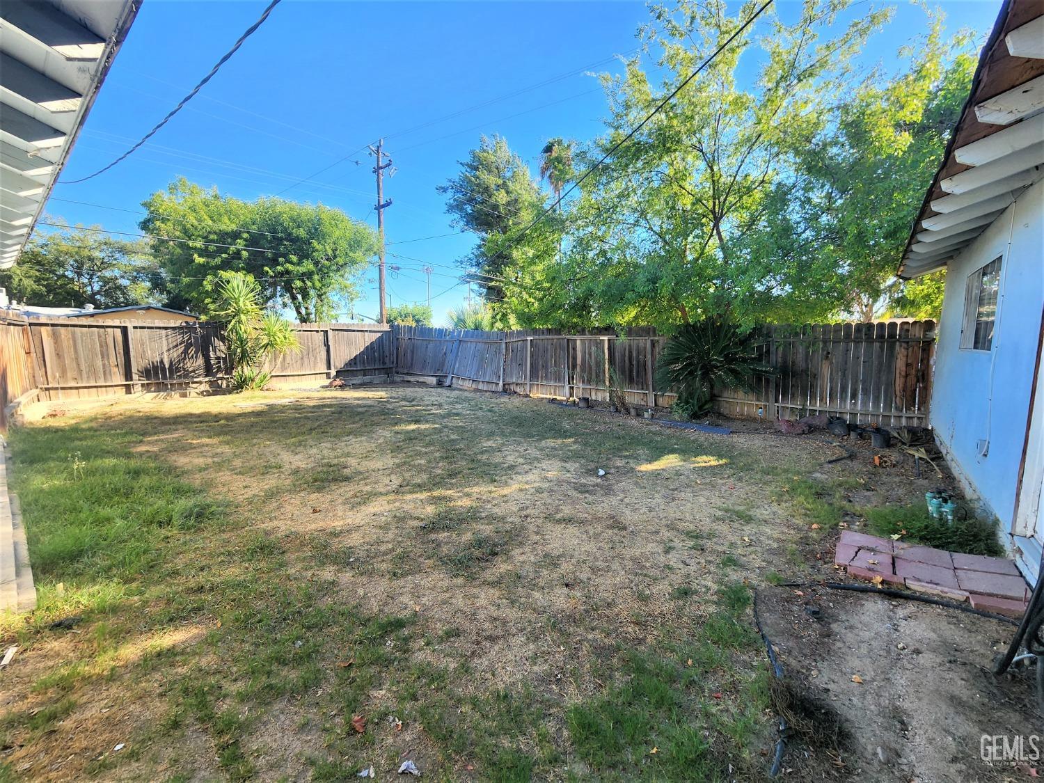 Undisclosed Address Bakersfield, CA 93306 - Photo 15 of 18 a view of a backyard with a small cabin