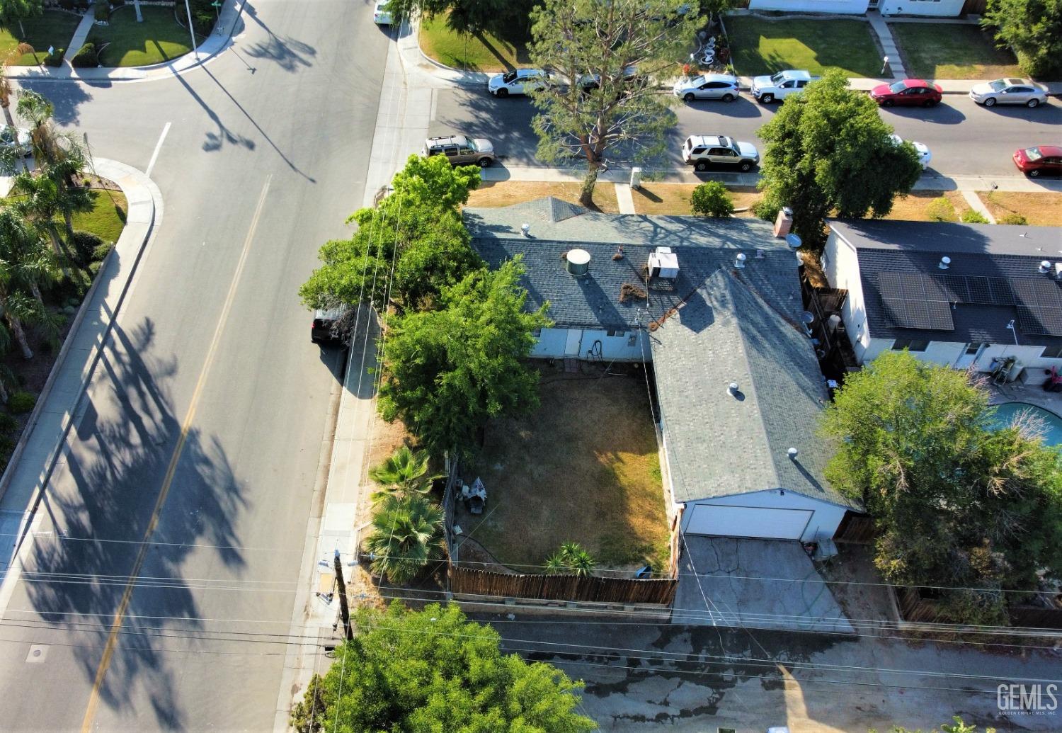 Undisclosed Address Bakersfield, CA 93306 - Photo 16 of 18 an aerial view of a house with a yard