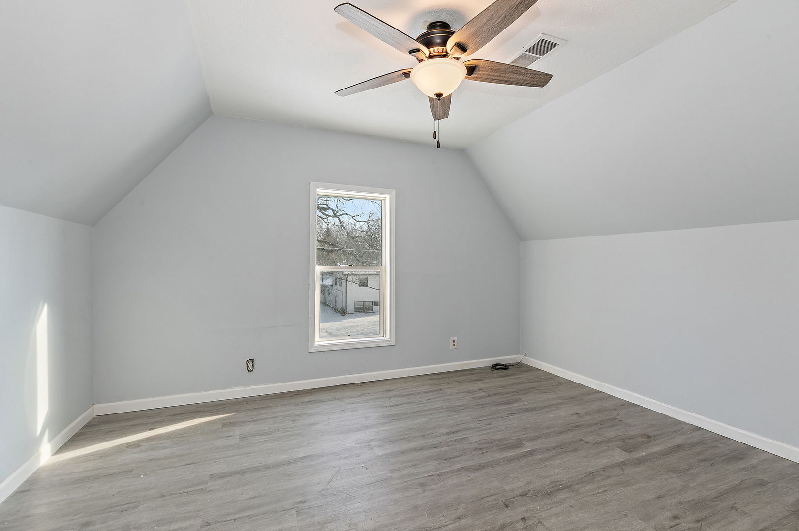 329 South 10th Street DeKalb, IL 60115 - Photo 14 of 25 wooden floor in an empty room with a window