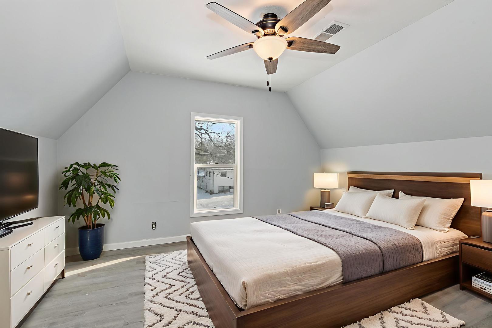 329 South 10th Street DeKalb, IL 60115 - Photo 15 of 25 a bedroom with a bed and a flat screen tv