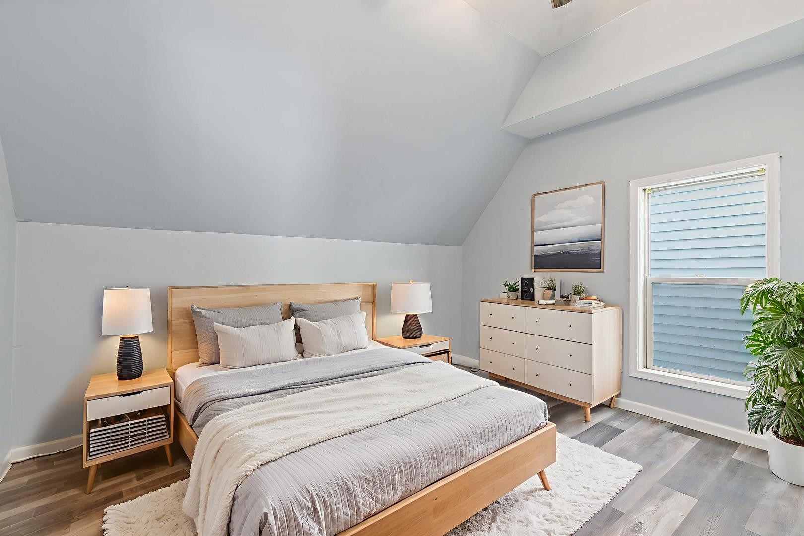 329 South 10th Street DeKalb, IL 60115 - Photo 17 of 25 a bedroom with a bed and a dresser