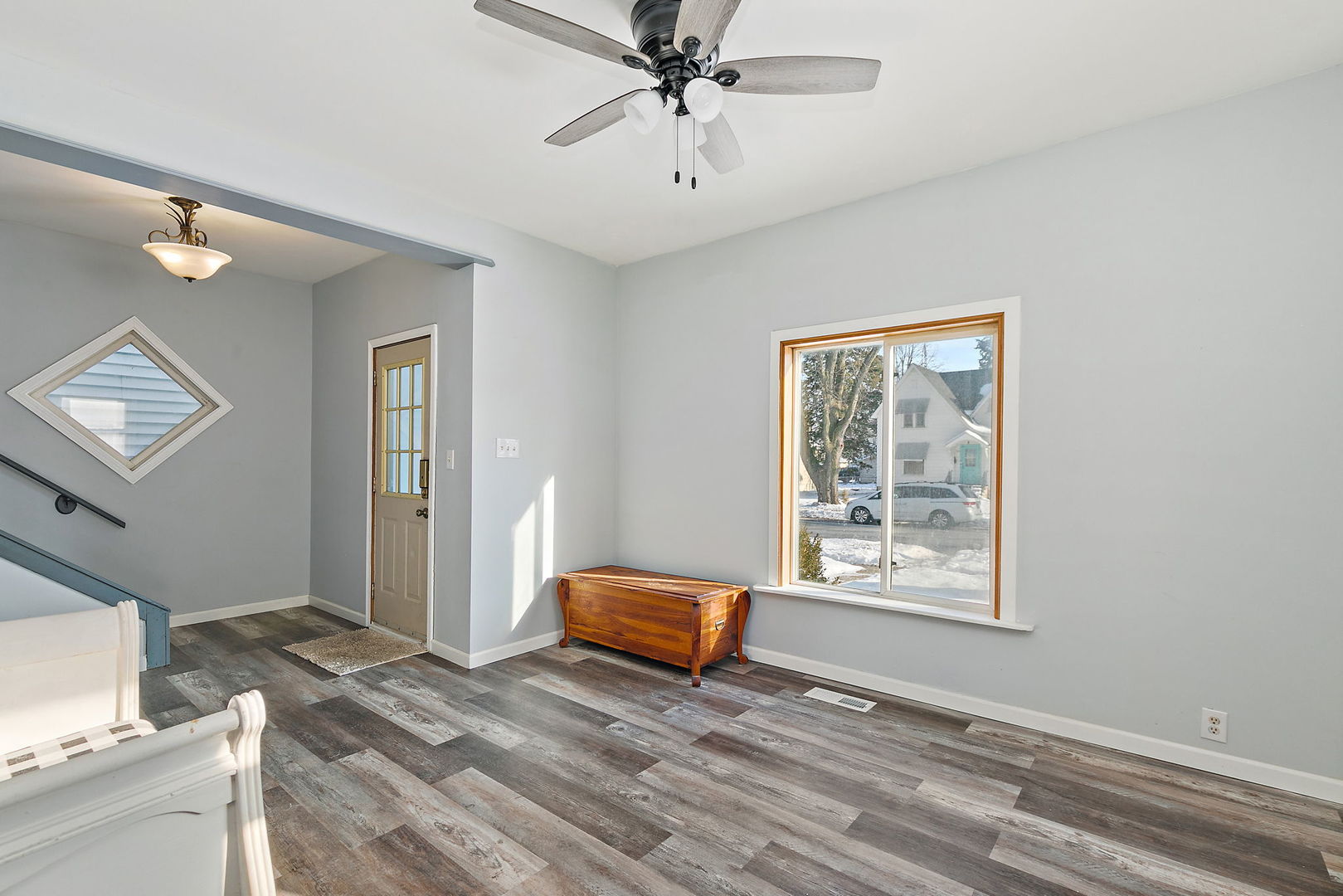 329 South 10th Street DeKalb, IL 60115 - Photo 2 of 25 a living room with a bed furniture and a window