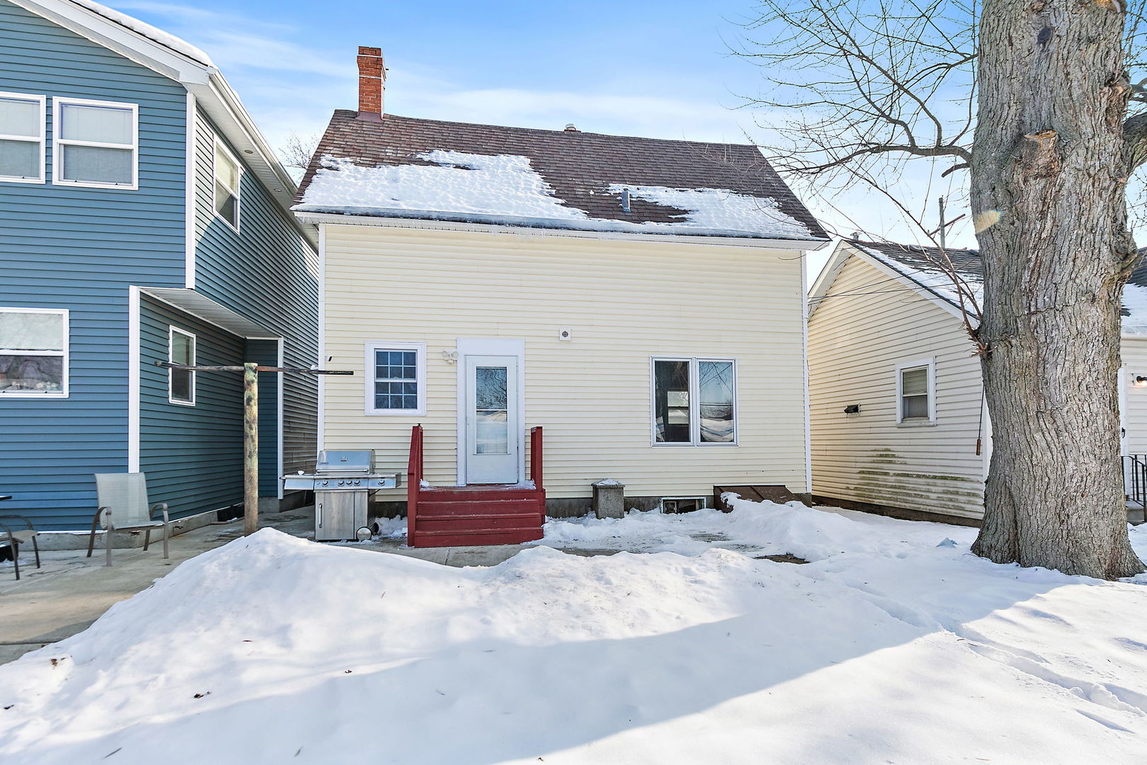 329 South 10th Street DeKalb, IL 60115 - Photo 22 of 25 a view of a house with a snow in the yard
