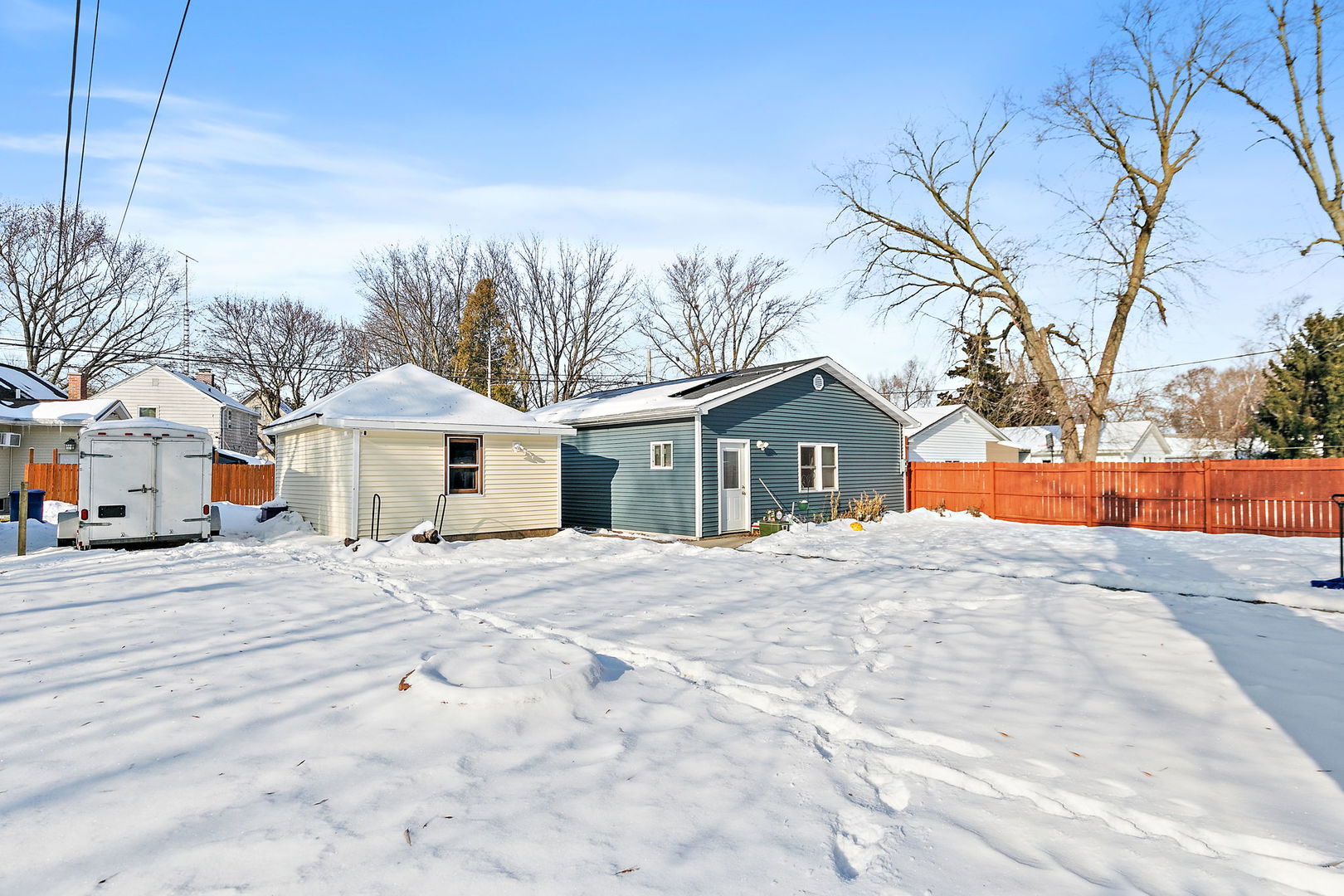 329 South 10th Street DeKalb, IL 60115 - Photo 24 of 25 a front view of a house with a yard and garage