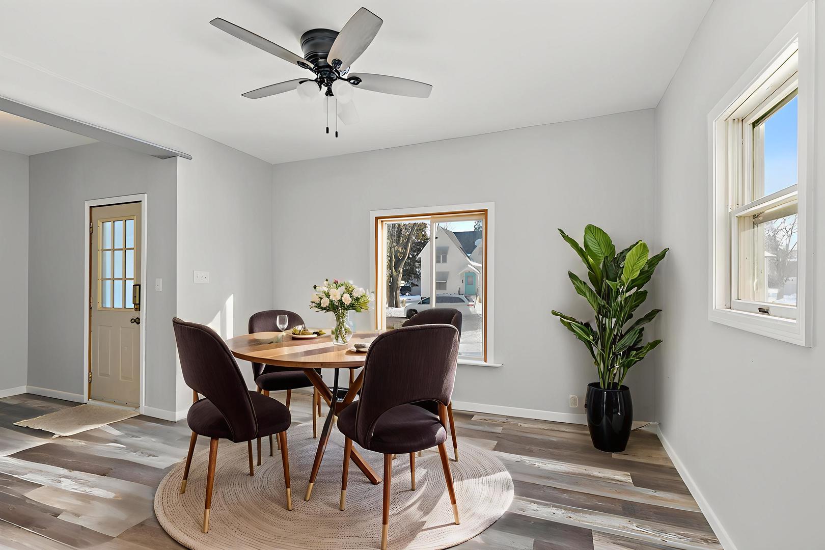 329 South 10th Street DeKalb, IL 60115 - Photo 4 of 25 a view of a livingroom with furniture and a potted plant