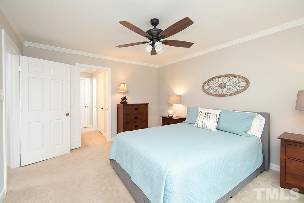 5903 Sentinel Drive Raleigh, NC 27609 - Photo 13 of 26 Master Bedroom with crown molding and ceiling fan.